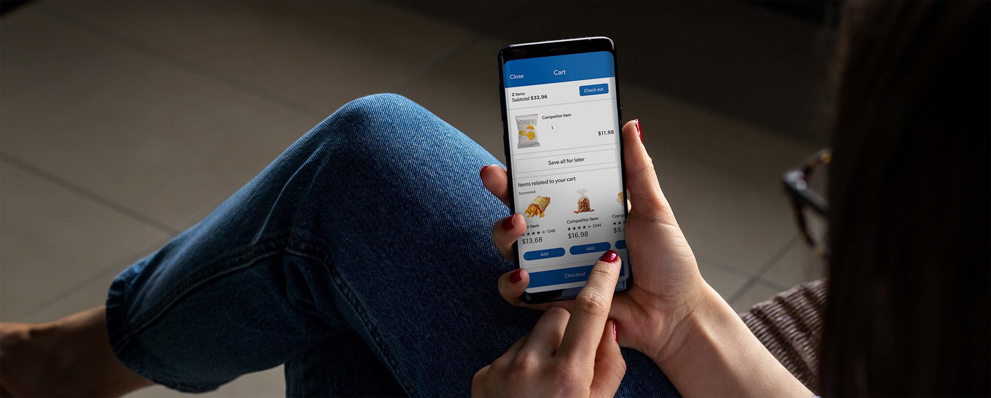 A member sits down with the Sam's Club app open on their mobile device.