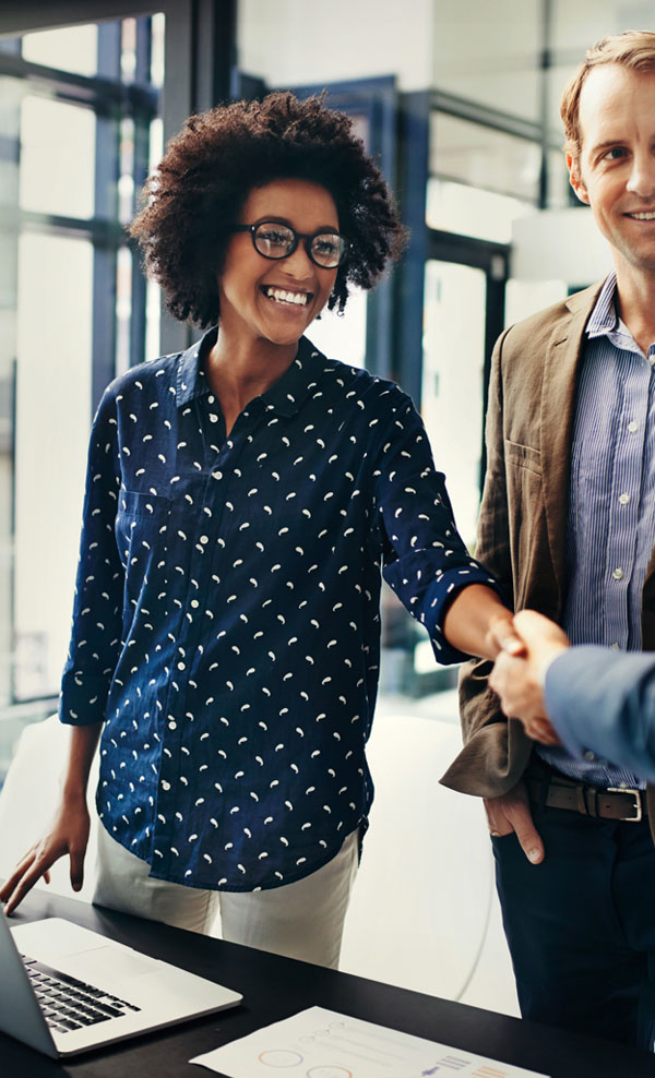 Partners in business meet and shake hands