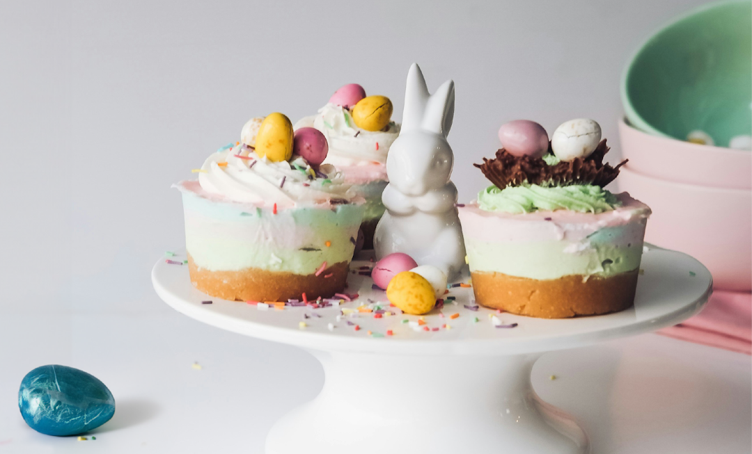 Colorful Easter cupcakes decorated with bunnies and eggs, showcasing festive designs for a joyful celebration.