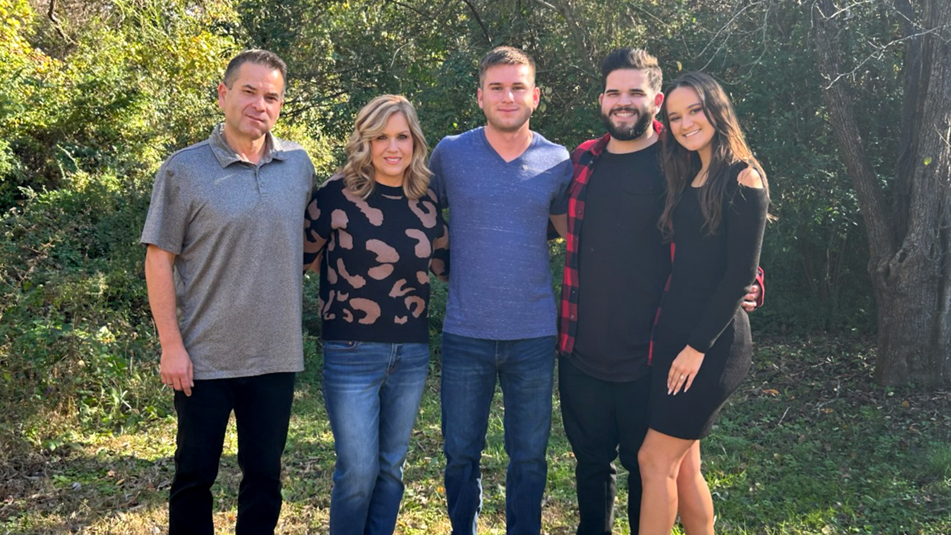 The Fishers, members of the Choctaw tribe and healthcare providers, smile in the sun: Joe, Amanda, Austin, Tyler and Gina.