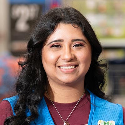 Walmart associate Estrella smiles at the camera in Store 5245 in San Antonio, Texas.